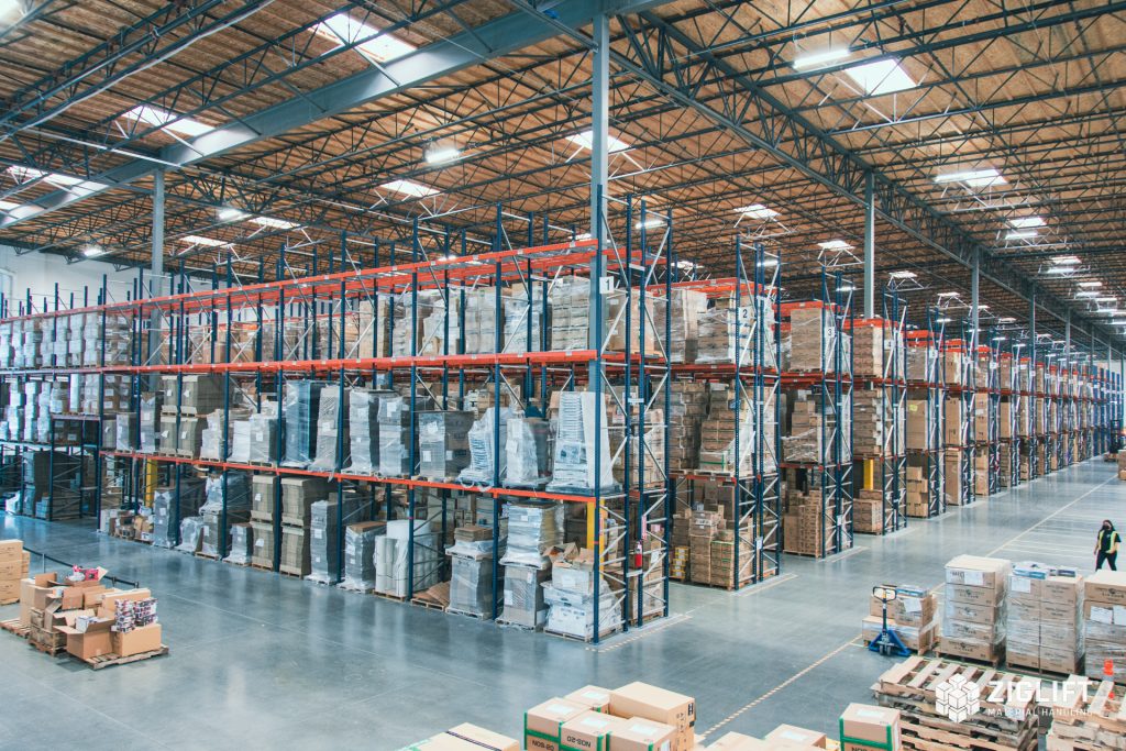 Rows of industrial pallet racks loaded with pallets in a St. Louis warehouse